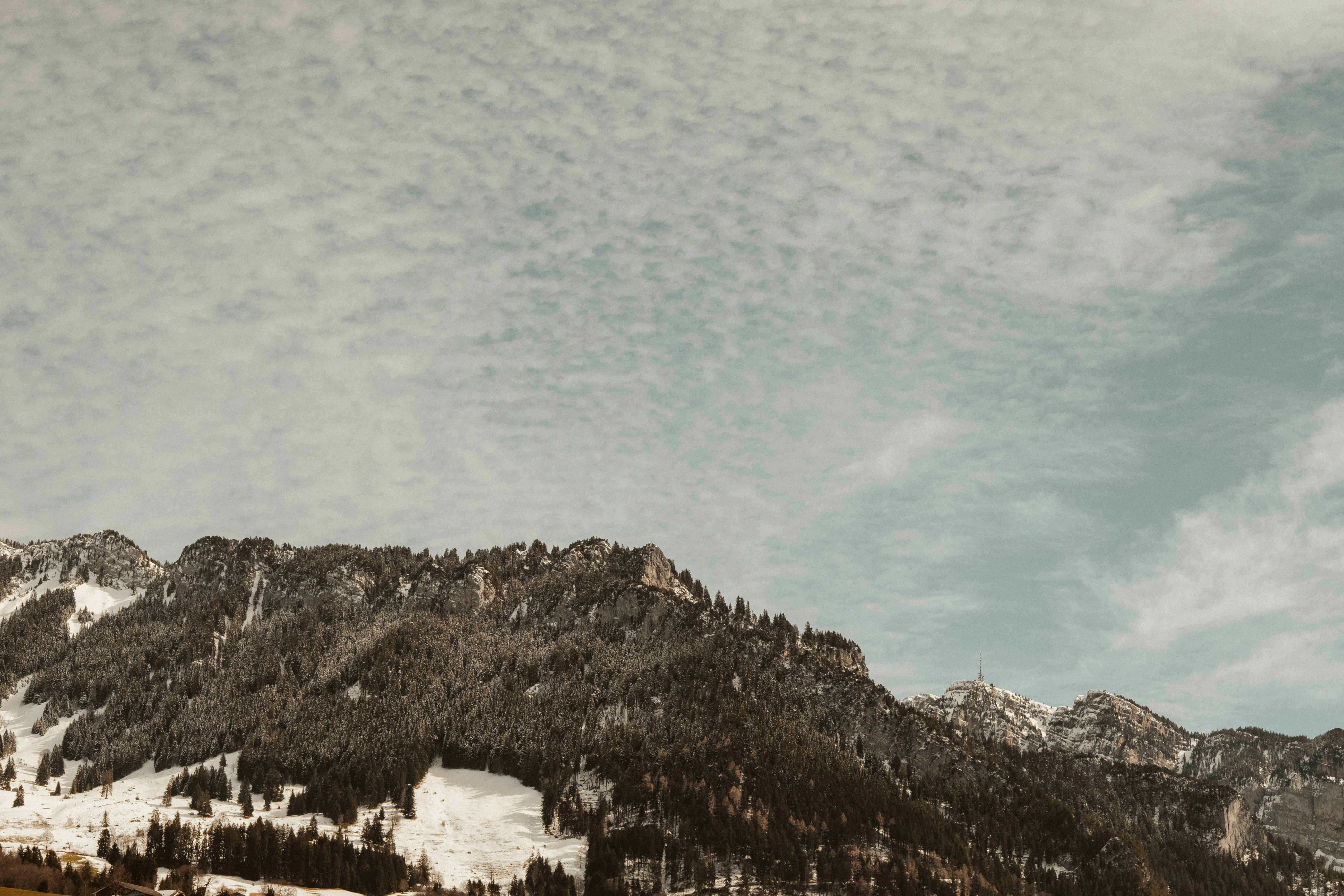 mountain under gray sky